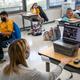 Third grade teacher Cara Denison speaks to students while live streaming her class via Google Meet at Rogers International School on November 19, 2020 in Stamford, Connecticut.